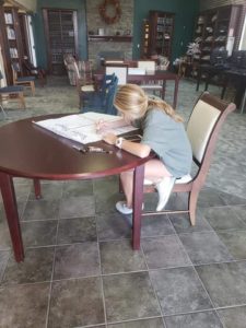 child working at a table