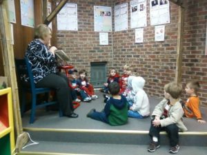 woman reading to children